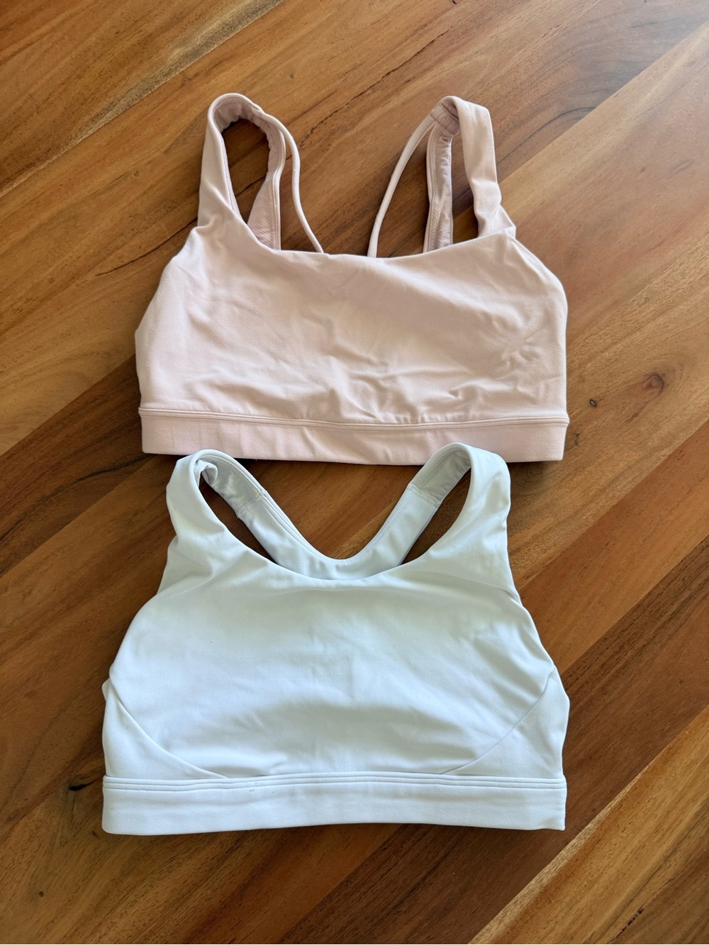 Athleta sports bras - blush pink and white size XS